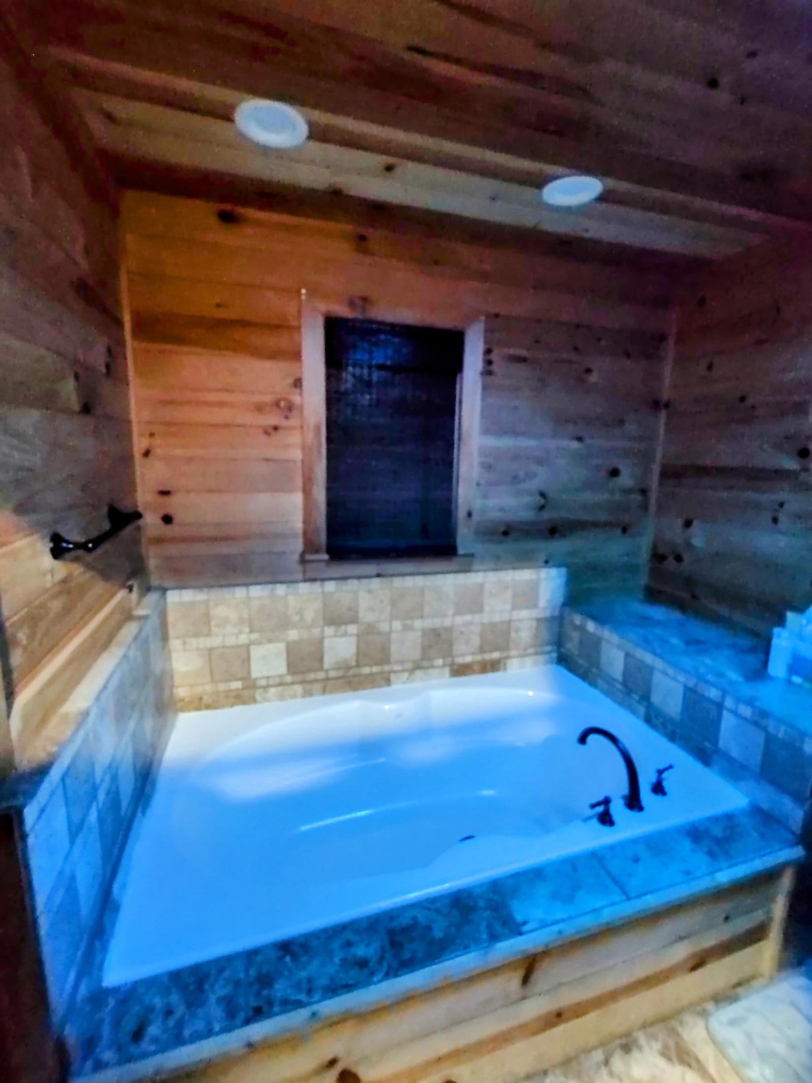 Luxury Roman soaking tub inside our secluded Blue Ridge mountain cabin rental in Turtletown TN
