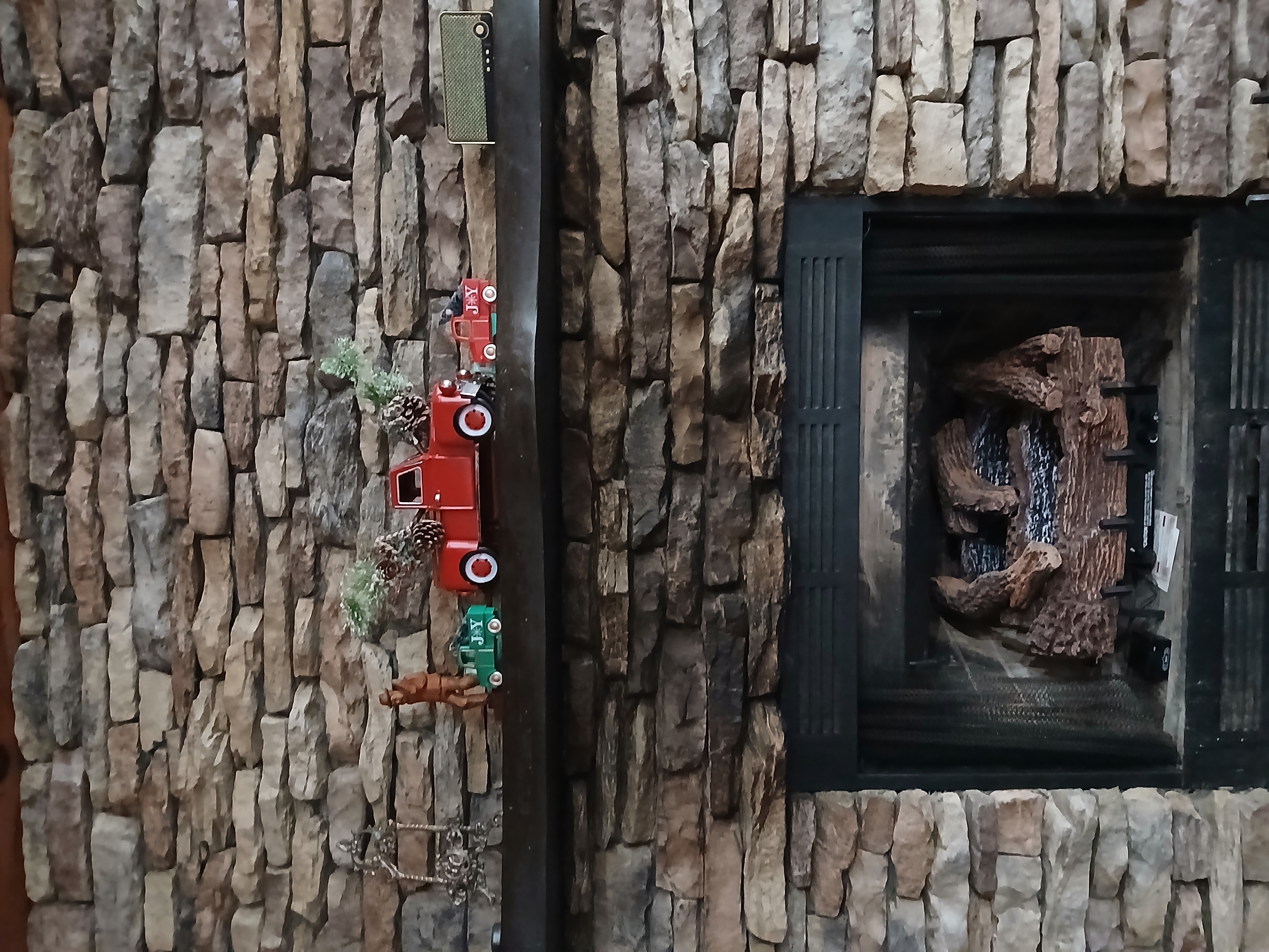 Cozy stone fireplace with gas logs at our secluded Turtletown cabin rental